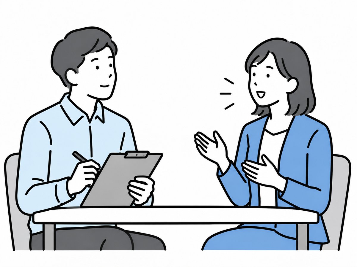 テーブルを挟んで対話する2人のイラスト